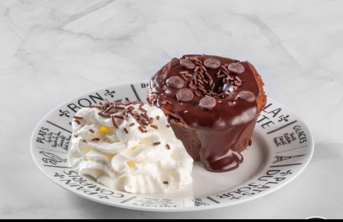 Chocolate dessert served with whipped cream